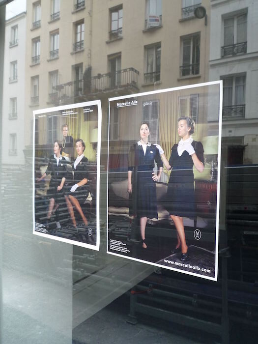 Reflection of a woman in a window of the Chloe shop on Rue St